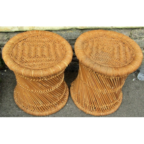 2228 - Two bamboo and wicker stools of cylindrical form, a further wicker basket, wicker and cane dog baske... 