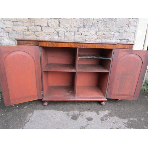 2270 - A Regency mahogany breakfront side cupboard enclosed by four arched panelled doors with applied flor... 