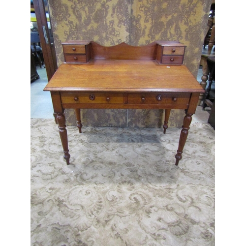 2274 - A 19th century satin birch writing desk with sloping top over two frieze drawers on turned supports ... 