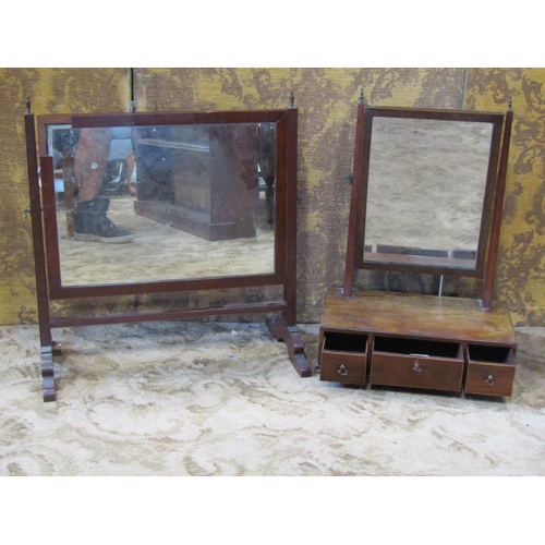 2278 - A Georgian mahogany toilet mirror with platform base enclosing three drawers on short ogee supports ... 