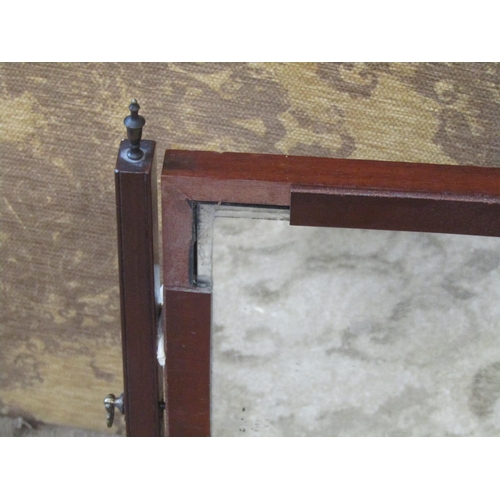 2278 - A Georgian mahogany toilet mirror with platform base enclosing three drawers on short ogee supports ... 