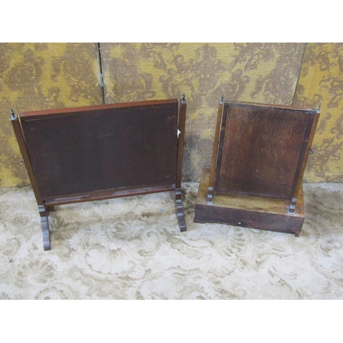 2278 - A Georgian mahogany toilet mirror with platform base enclosing three drawers on short ogee supports ... 