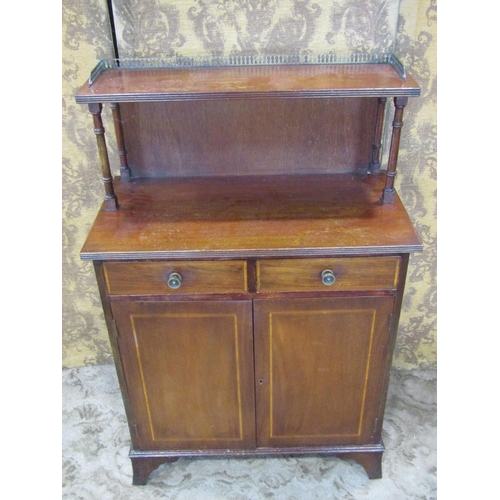 2286 - A Regency style mahogany chiffonier enclosed by two panelled doors and two frieze drawers, the raise... 