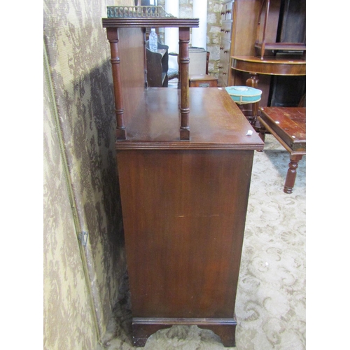 2286 - A Regency style mahogany chiffonier enclosed by two panelled doors and two frieze drawers, the raise... 