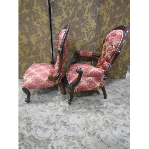 2307 - A pair of Victorian style drawing room chairs of graduated form with carved cabriole forelegs