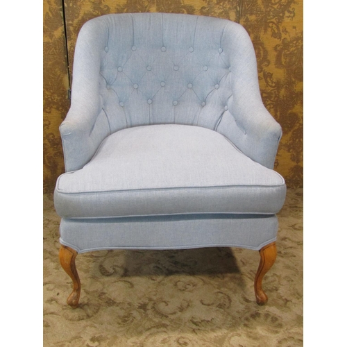 2315 - An Edwardian style tub chair with deep seat, buttoned back and upholstered finish on shaped forelegs