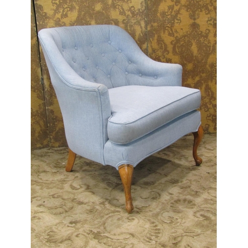 2315 - An Edwardian style tub chair with deep seat, buttoned back and upholstered finish on shaped forelegs