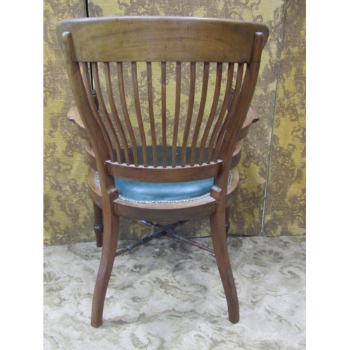 2322 - A late 19th century mahogany office chair with stick back and upholstered seat on turned supports