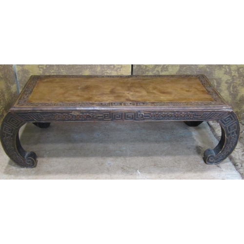 2323 - A Chinese hardwood opium table with carved detail, 110 cm long