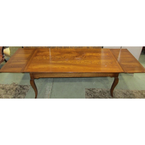 2347 - A good ashwood drawer leaf kitchen table the plank top with cleated ends raised on four shaped suppo... 