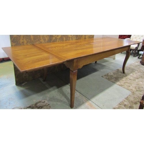 2347 - A good ashwood drawer leaf kitchen table the plank top with cleated ends raised on four shaped suppo... 