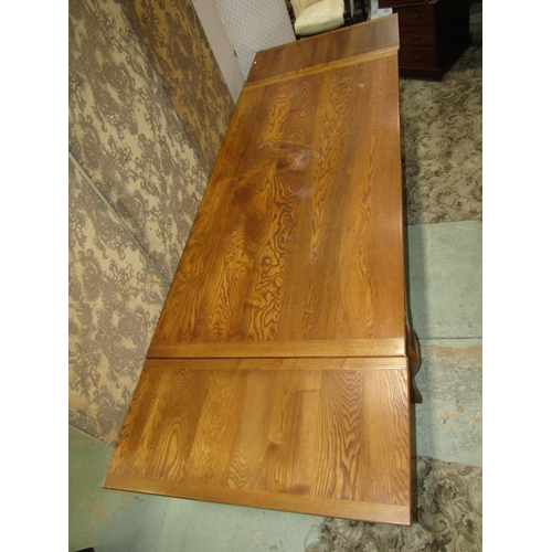 2347 - A good ashwood drawer leaf kitchen table the plank top with cleated ends raised on four shaped suppo... 