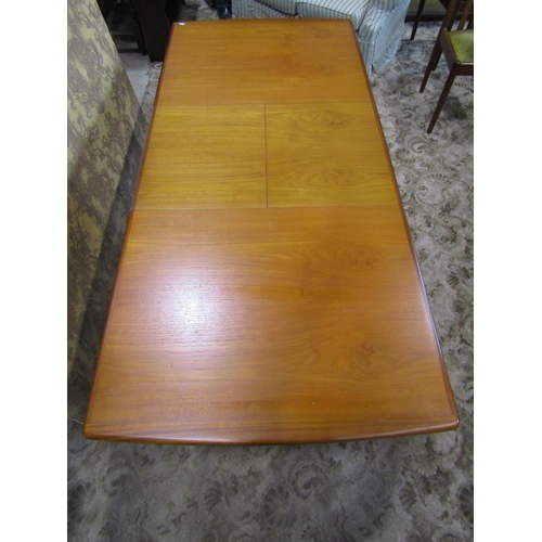 2349 - A Meredew teak extending dining table raised on four turned and tapering supports, together with a s... 