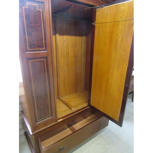 2352 - A good quality inlaid Edwardian mahogany wardrobe with mirror panelled door over a single frieze dra... 