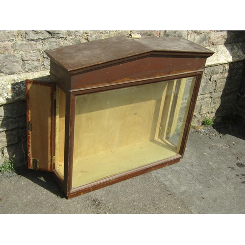 2367 - A Victorian pine wall mounted shop display cabinet with glazed panelled front, set beneath an archit... 