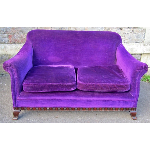 2369 - An Edwardian cottage sofa to seat two, raised on a carved and moulded lower frame, with later uphols... 