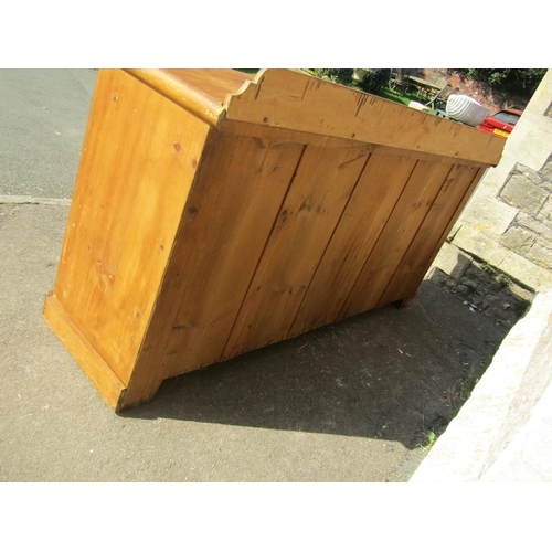 2431 - A Victorian pine kitchen dresser, central arched and panelled doors flanked by an arrangement of nin... 