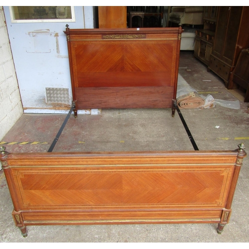 2474 - A French double bedstead, the head and footboards with chevron banded string inlaid and applied bras... 