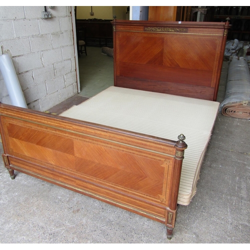 2474 - A French double bedstead, the head and footboards with chevron banded string inlaid and applied bras... 