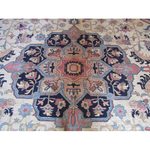 2733 - A large eastern wool carpet with pale cream ground, with central medallion, abstract floral detail s... 