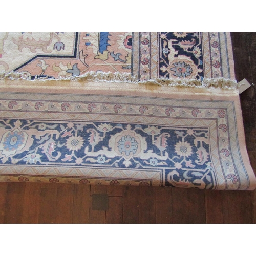 2733 - A large eastern wool carpet with pale cream ground, with central medallion, abstract floral detail s... 