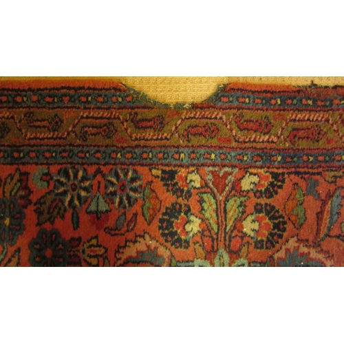 2725 - A very long eastern style runner, with repeating floral and vase detail, upon a pink ground within n... 