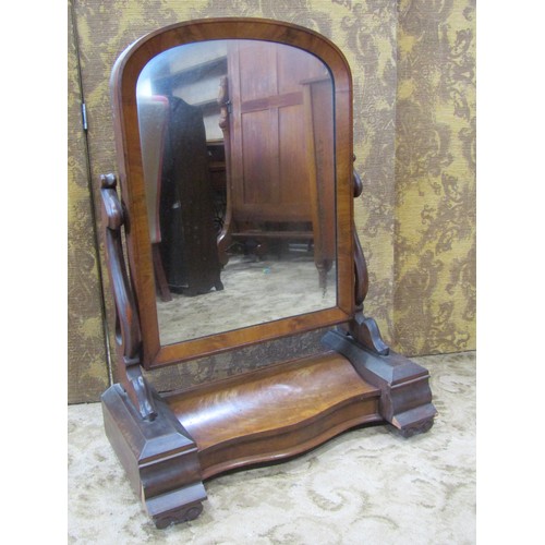 2180 - A Victorian pine cheval mirror with simple arched frame raised on chamfered swept scrolled and pierc... 