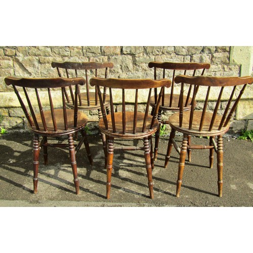 2134 - A set of five stained beech Swedish stickback kitchen chairs with circular seats