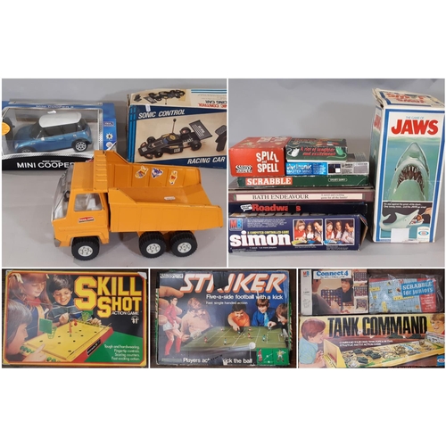 Collection of vintage games and model vehicles including boxed Radio controlled Mini Cooper by Nikko, tipper truck by Sanson, Striker football game, Roadways, Simon, Jaws, Scrabble, Connect 4, Mousie Mousie etc. All unchecked.