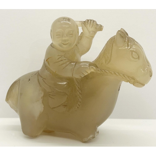 1078 - A Chinese pale carved jade figure, horse and rider (A/F) (partial) 7cm high, 17cm long (displayed in... 