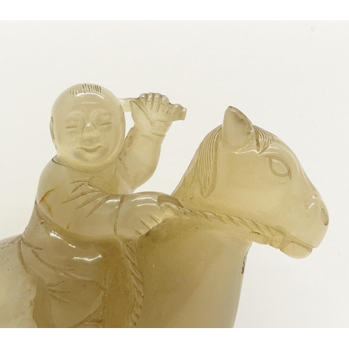 1078 - A Chinese pale carved jade figure, horse and rider (A/F) (partial) 7cm high, 17cm long (displayed in... 