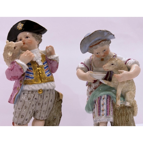 1092 - A pair of 19th century Meissen porcelain figures, infant shepherd and shepherdess, each with cross s... 