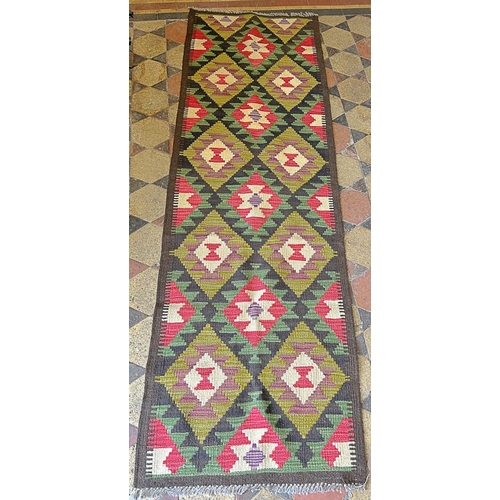 2715 - A Maimana Kilim runner, with repeating multicoloured medallions,202cm x 64cm approx