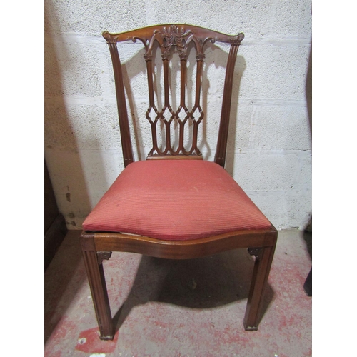 2451 - A set of twelve (10+2) George III style mahogany dining chairs with carved and pierced Gothic tracer... 