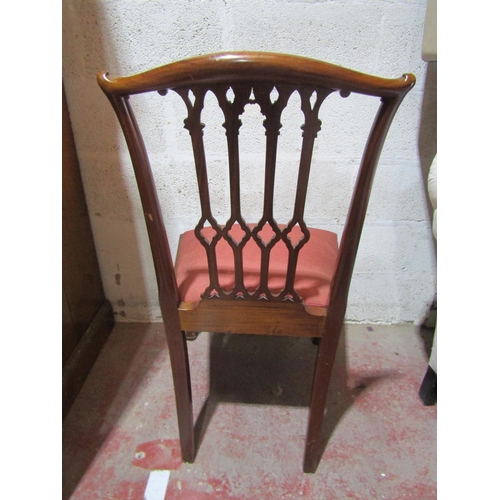 2451 - A set of twelve (10+2) George III style mahogany dining chairs with carved and pierced Gothic tracer... 