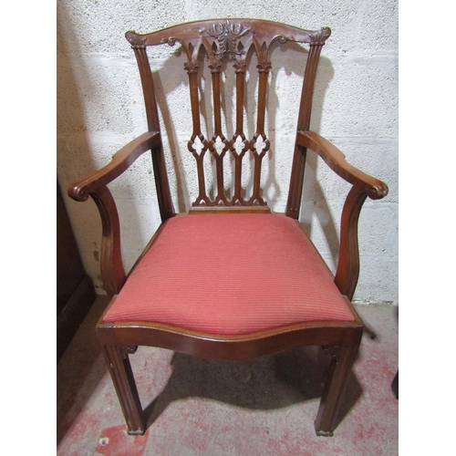 2451 - A set of twelve (10+2) George III style mahogany dining chairs with carved and pierced Gothic tracer... 