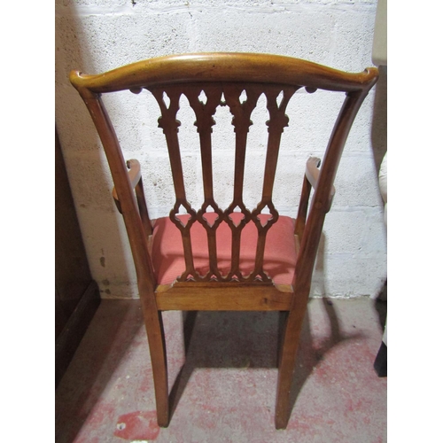 2451 - A set of twelve (10+2) George III style mahogany dining chairs with carved and pierced Gothic tracer... 