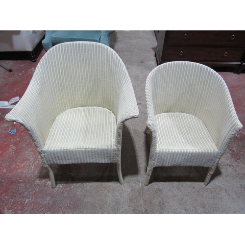 2453 - Two Lloyd Loom tub chairs with alter panted finish