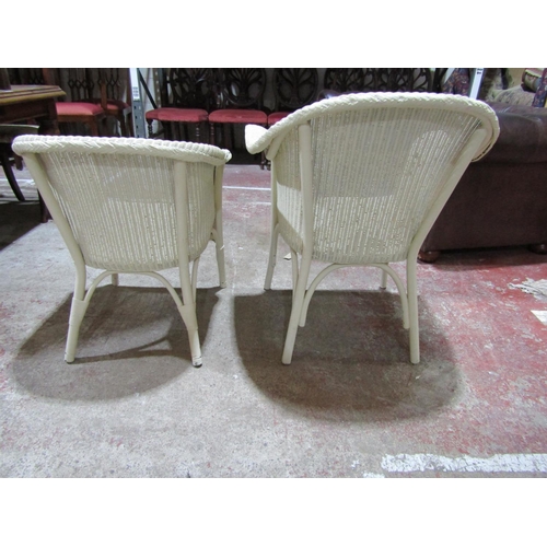 2453 - Two Lloyd Loom tub chairs with alter panted finish