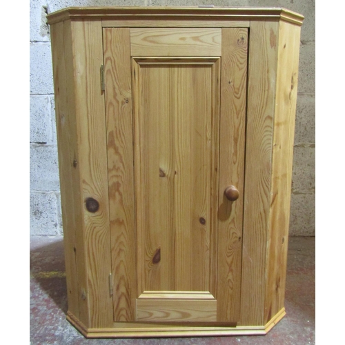 2463 - A contemporary pine corner cupboard enclosed by a door, 91cm high