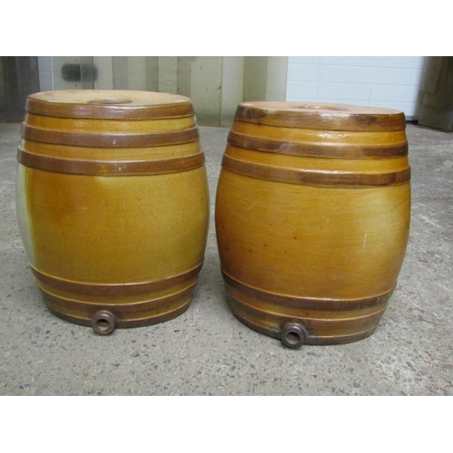A pair of 19th century salt glazed barrels of oval form