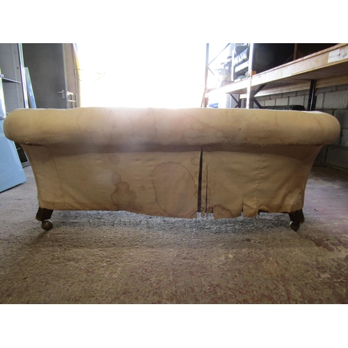 2487 - A Victorian Chesterfield frame on turned supports, 2 metres wide approx