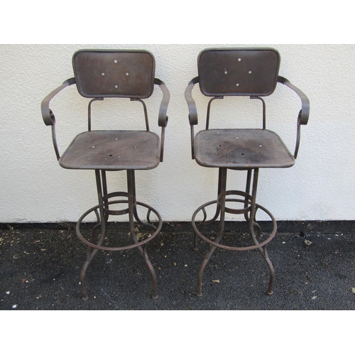 2488 - A pair of vintage steel frame high chairs with swivel action and foot rests