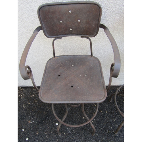 2488 - A pair of vintage steel frame high chairs with swivel action and foot rests