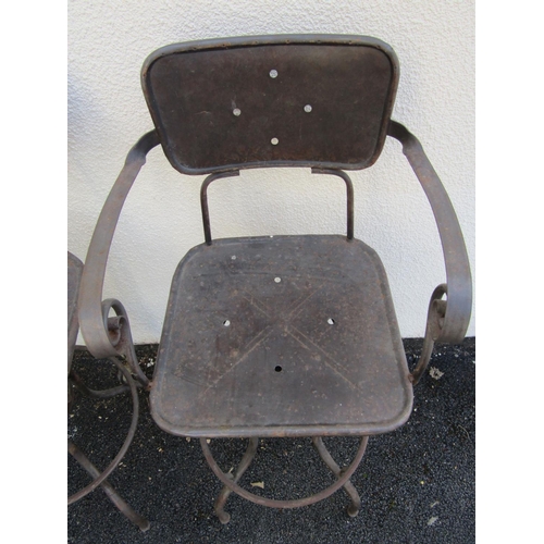 2488 - A pair of vintage steel frame high chairs with swivel action and foot rests