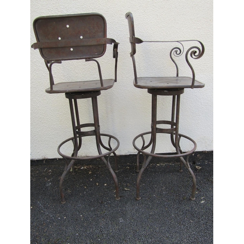 2488 - A pair of vintage steel frame high chairs with swivel action and foot rests