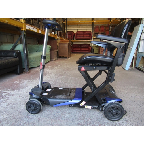 2504 - A Solax mobility scooter with folding framework with charger