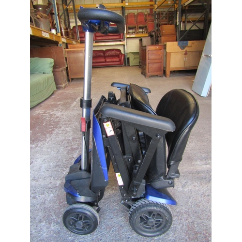 2504 - A Solax mobility scooter with folding framework with charger