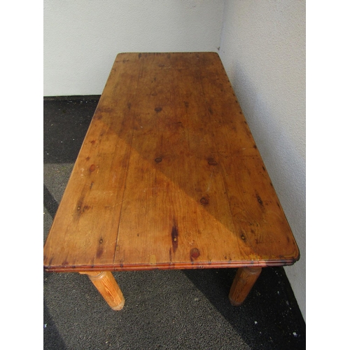 2515 - A stripped pine farmhouse kitchen table, the plank top with two frieze drawers on hexagonal supports... 