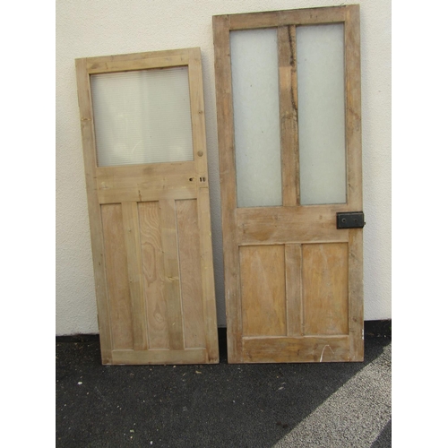 2517 - Five various stripped pine and panelled doors, two partially glazed